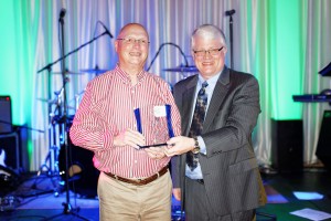 Cliff Scott (left) accepts his award from Jim Lee.