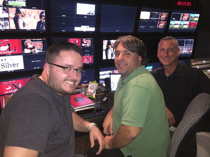 From left: ESPN's Dane Lentz, Chris Damiani, and Tim Sutton at the front bench, preparing for tonight's broadcast from the campus of the California School for the Deaf