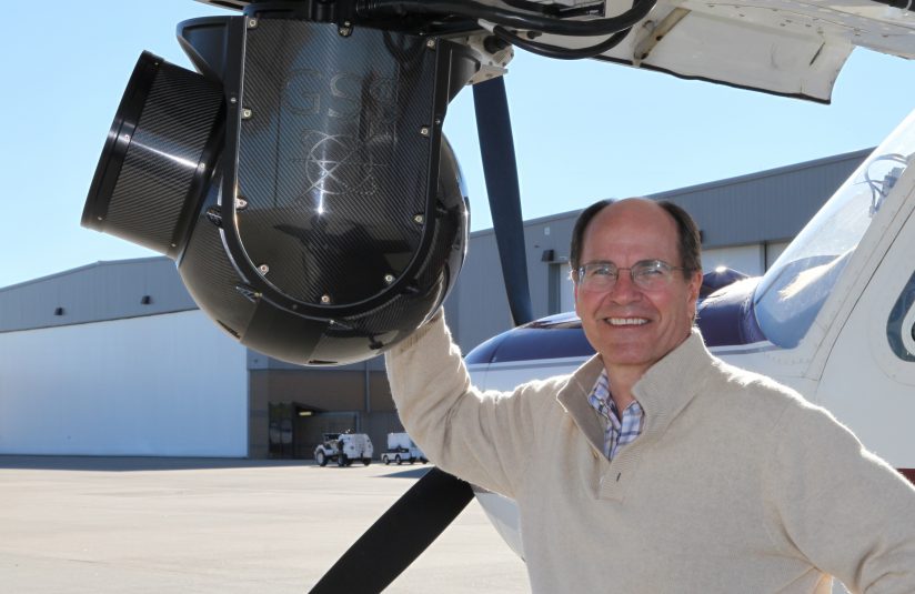 Bob Mikkelson and one of Winged Vision’s three fixed-wing aircraft.