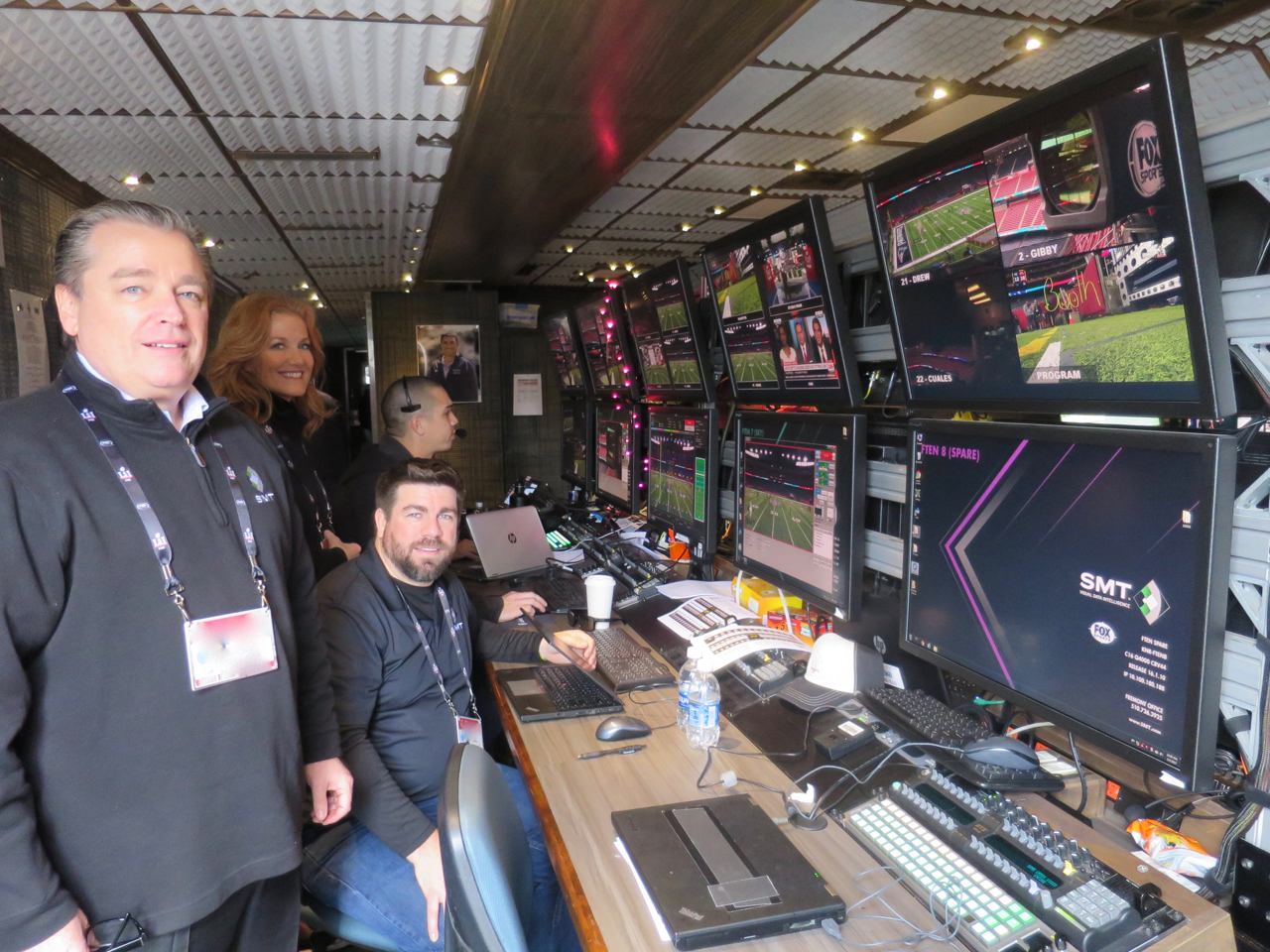SMT's Gerard Hall (left) and Patricia Hopkins (center) with the SMT production team at Super Bowl LI.