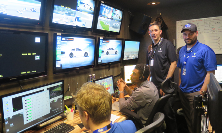(standing, l-to-r) Paulus Weemaes and Phillip Cochran inside the main SMT production area in their truck at the Daytona 500.